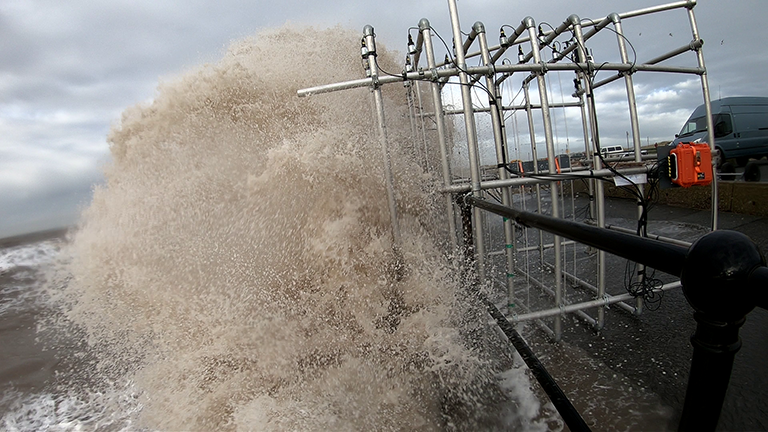 Wave overtopping and WireWall in action at Crosby Beach, January 2019