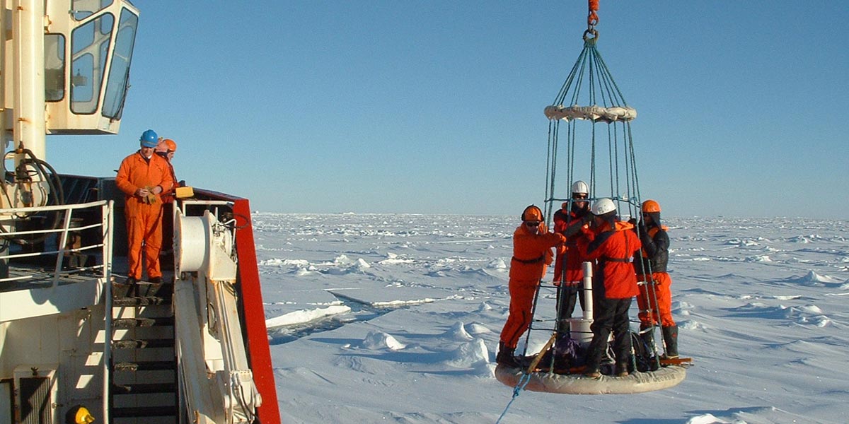 A team was landed onto the sea ice with a manual ice drill to make ice thickness measurements.