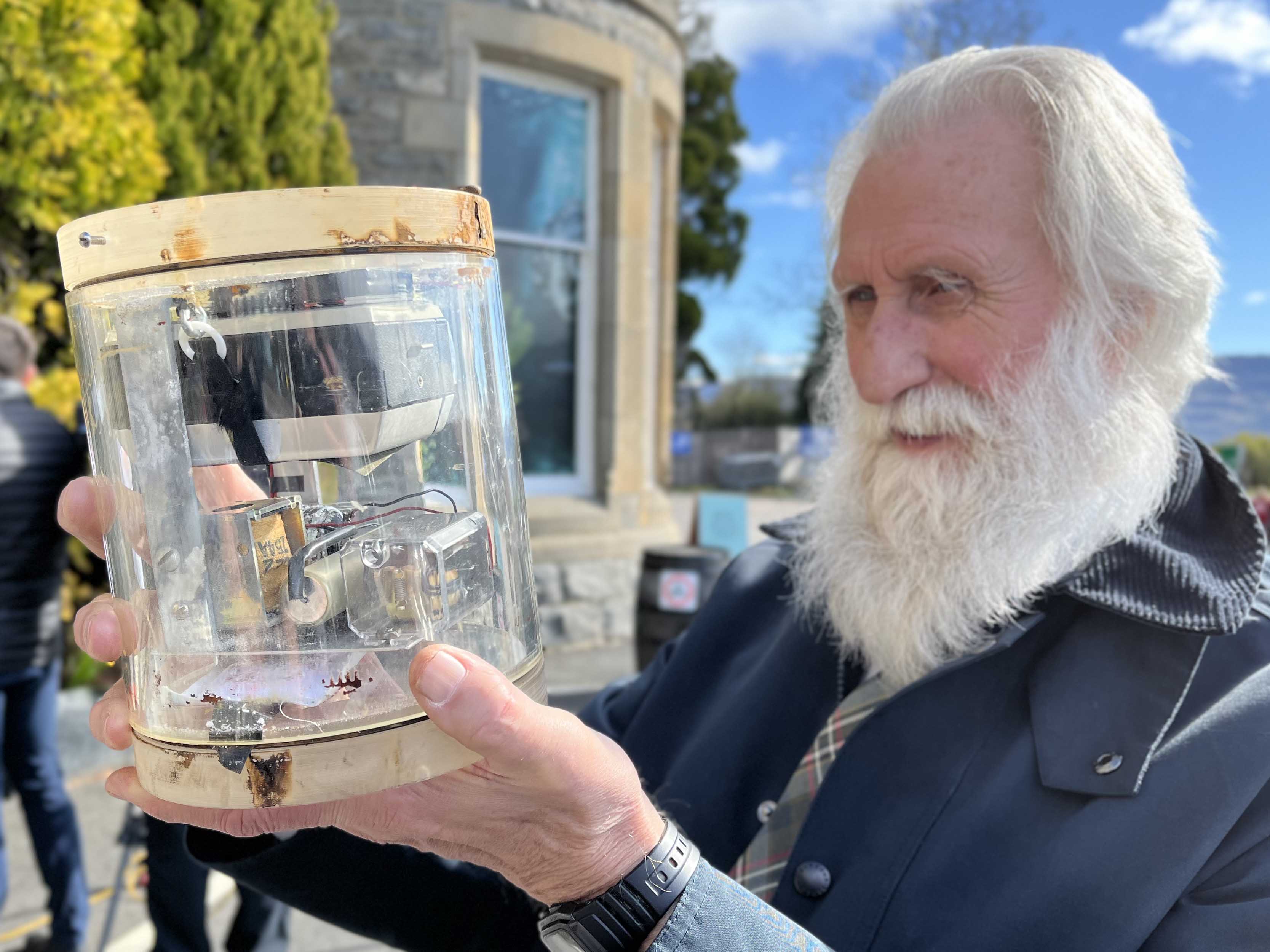 Nessie expert Adrian Shine with the underwater camera in its housing.