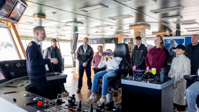 Captain with a group of visitors
