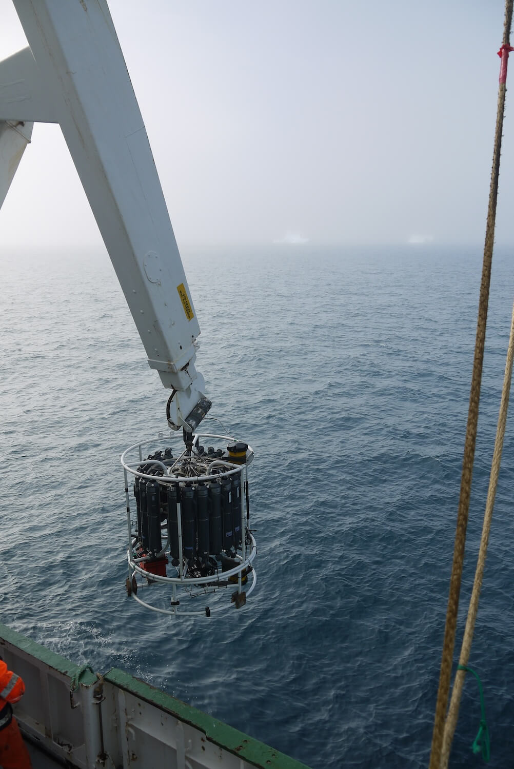 CTD deployment with icebergs in the background