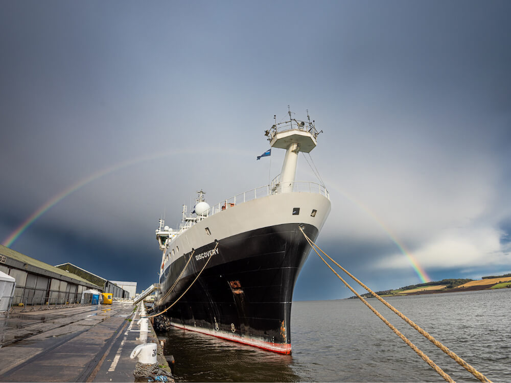RRS Discover and a rainbow