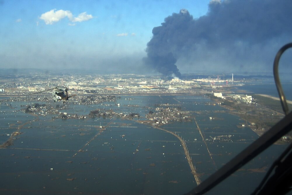 Helicopter flying over the port of Sendai