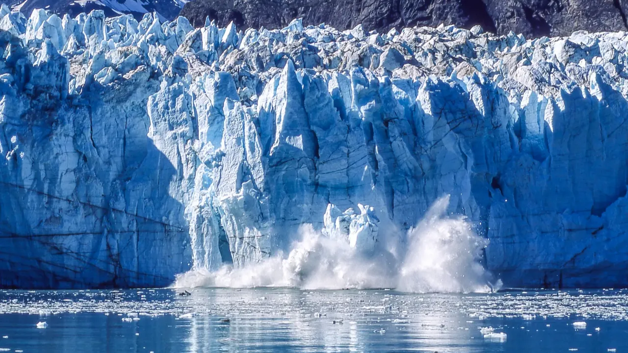 Ice wall collapsing into the ocean