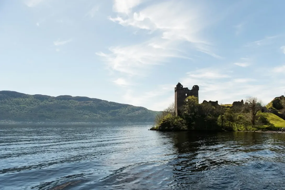 Loch Ness with a castle structure on the shore