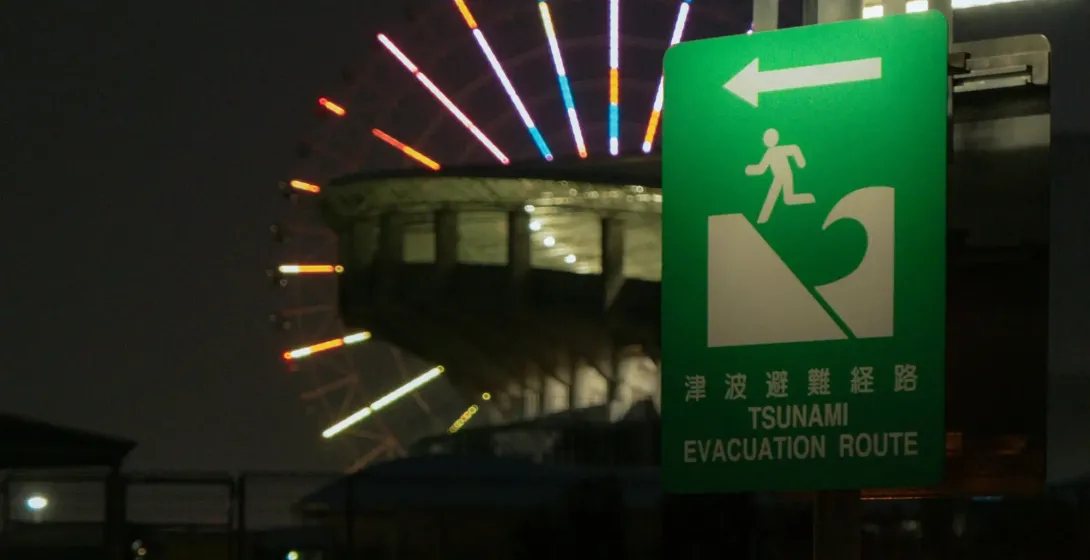 Tsunami evacuation route sign at a pier