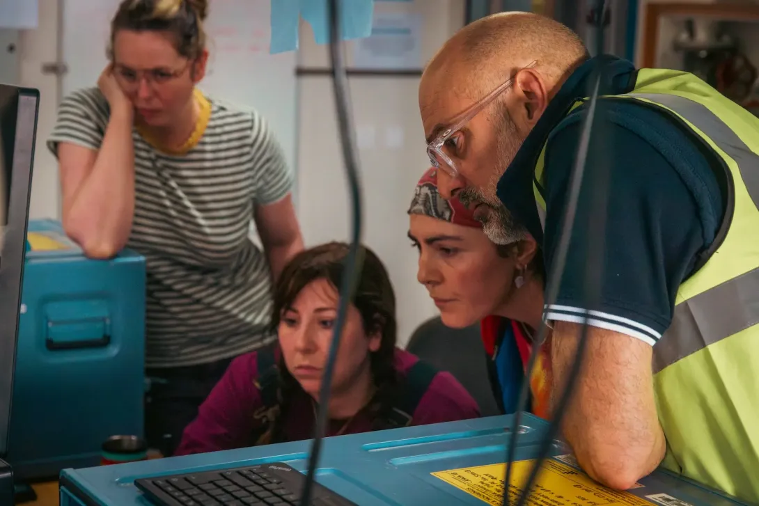 Scientists observing RAPID equipment results